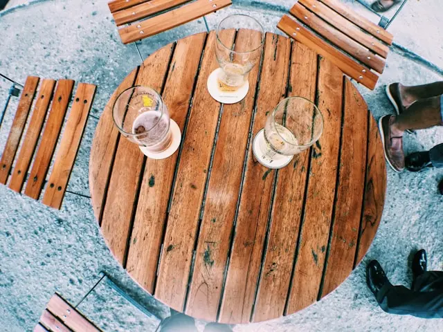 Three Cocktail Drinks Placed on top of a Bar Table you can find on Gecko” style=