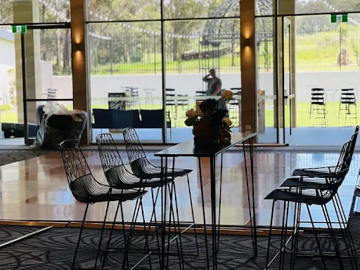 An image of a bar with tables.