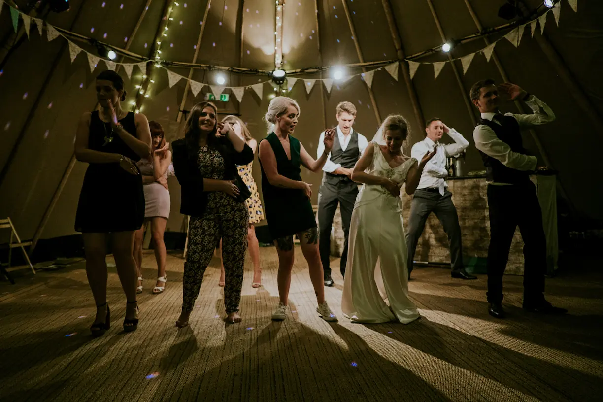 People dancing underneath a warm white fresnel light from Gecko