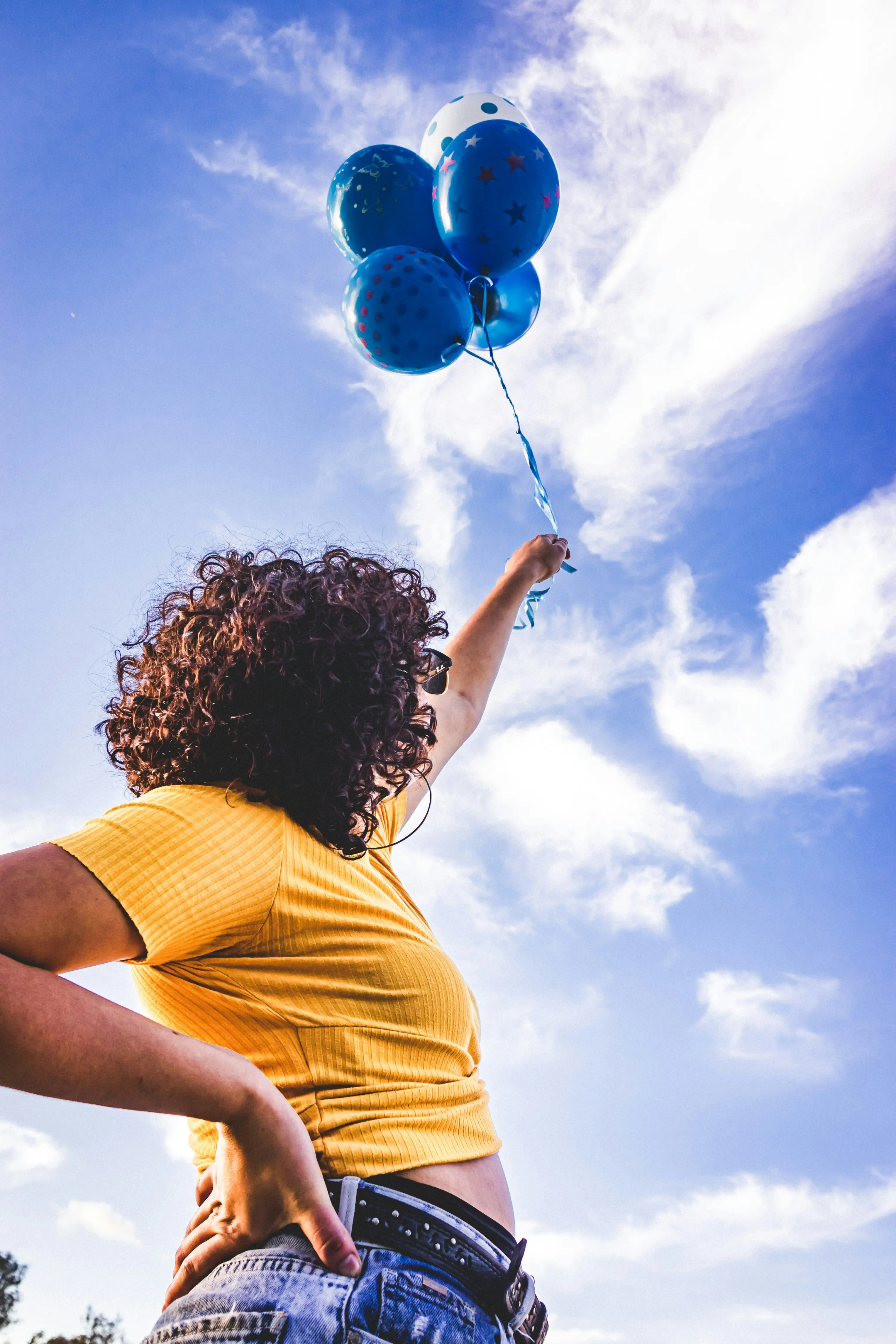 Woman Holding Blue Balloons you can find on Gecko” style=