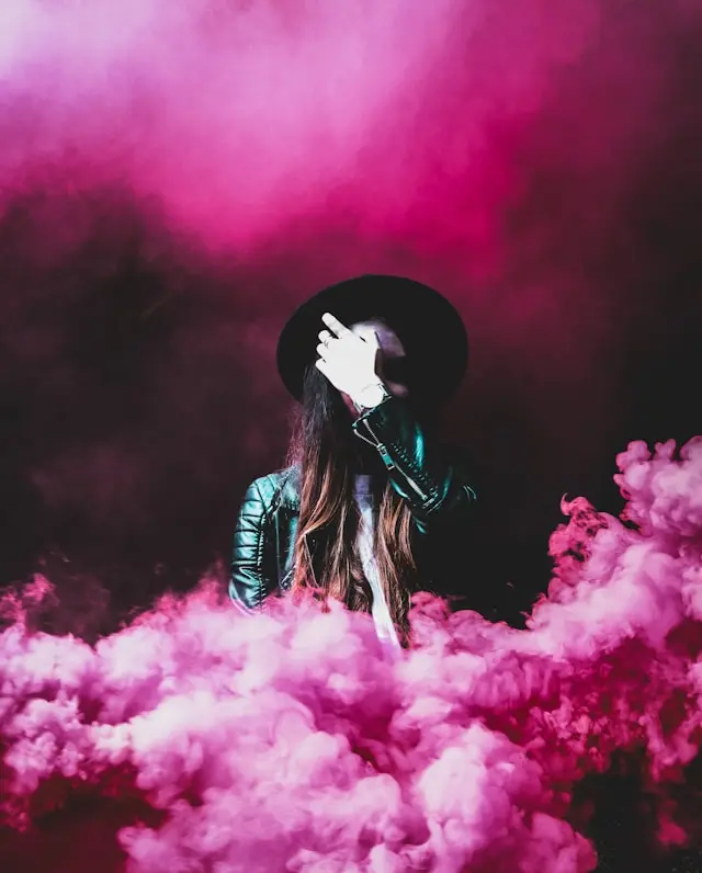 A Photoshoot with a Person Around Pink Smokes Made by Smoke Machines you can find on Gecko” style=