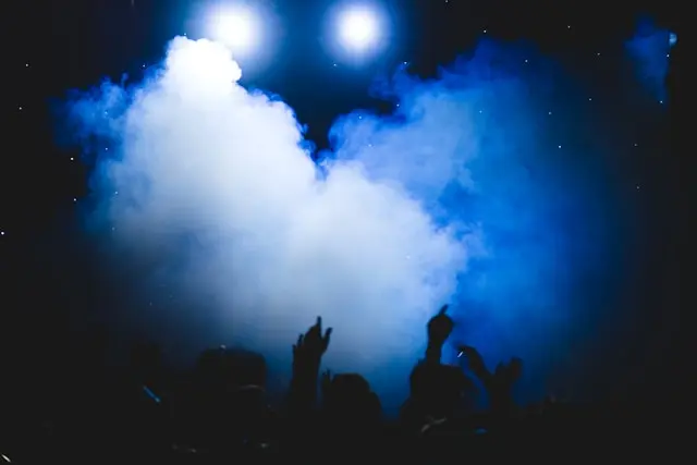 A Party with People Surrounded by Smoke Made by Smoke Machines you can find on Gecko” style=